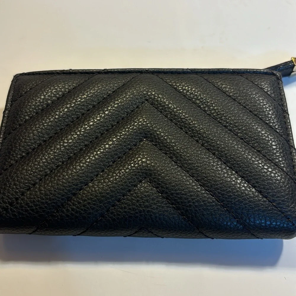 Victoria’s Secret small clutch/wallet black with gold color accents.